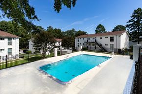Doraville apartment for rent - the swimming pool at 1861 muleshoe road with apartment buildings in the background