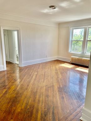 East Orange apartment for rent - an empty living room with a hard wood floor and a window
