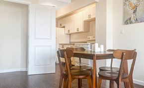 Bronx apartment for rent - a kitchen with a table and chairs