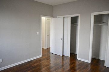 Irvington apartment for rent - a living room with a wood floor and three doors