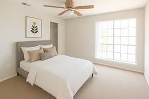Marietta apartment for rent - A bedroom with a large bed and a ceiling fan.