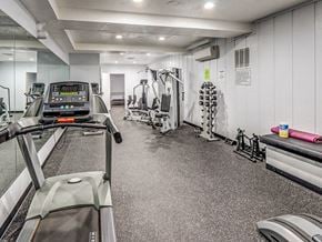 Mountain View apartment for rent - A gym with treadmills, weights, and exercise equipment.