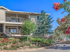 Los Gatos apartment for rent - A building with a balcony and a tree in front of it.