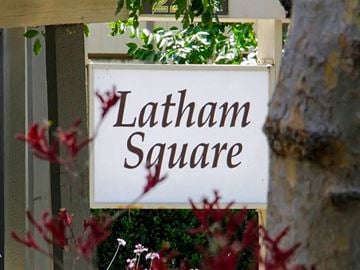 Mountain View apartment for rent - A sign that says Latham Square is mounted on a wall.