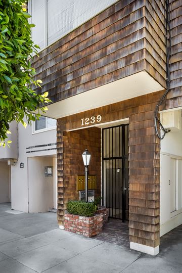San Francisco apartment for rent - the front of a brick building with a black door
