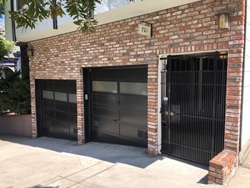San Francisco apartment for rent - a brick building with two garage doors and a gate