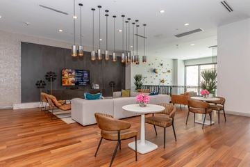 The Colony apartment for rent - a living room with a couch and tables and chairs