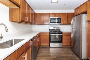 Shelton townhouse for rent - A kitchen with wooden cabinets and stainless steel appliances.