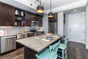 Dallas apartment for rent - A kitchen with a table and chairs.