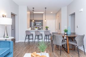 Meriden apartment for rent - A modern dining room with a table set for four.