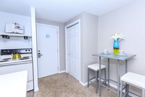East Haven apartment for rent - A kitchen area with a stove, table, and chairs.