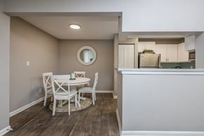 Atlantic Beach apartment for rent - A dining room with a white table and chairs.