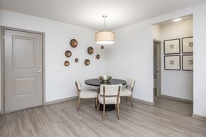Jacksonville apartment for rent - A dining room with a round table and chairs.