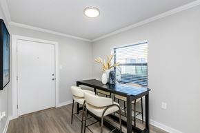 St. Petersburg apartment for rent - A dining room with a table and chairs.