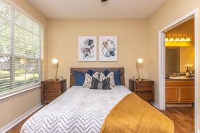 Jacksonville apartment for rent - A bedroom with a large bed and two nightstands.