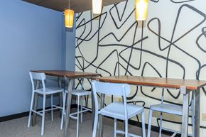 East Haven apartment for rent - A dining area with a blue wall and a black line drawing on the wall.