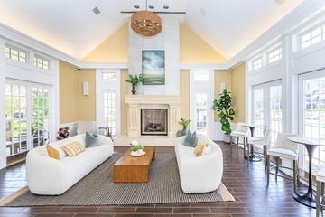 Middletown apartment for rent - A living room with a fireplace and a painting on the wall.