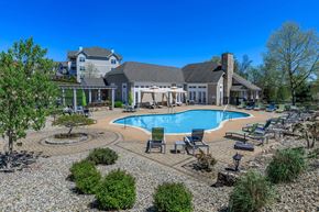 Middletown apartment for rent - A large house with a pool in the backyard.