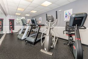 Groton apartment for rent - A gym with treadmills, elliptical machines, and other exercise equipment.