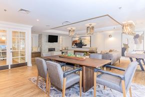 Stamford apartment for rent - A modern dining room with a wooden table and grey chairs.