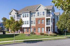 Cliffwood apartment for rent - A large two story apartment building with a balcony on the second floor.