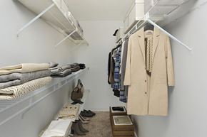 West Haven apartment for rent - A white closet with a beige coat hanging on the right.