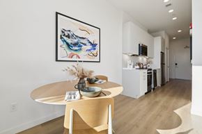 Stamford apartment for rent - A modern dining room with a round table and chairs.