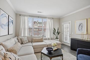 Stamford apartment for rent - A living room with a grey couch and a coffee table.