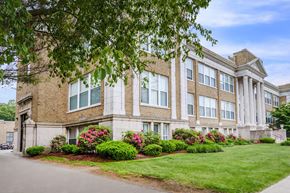 West Haven apartment for rent - A large building with a lawn in front of it.