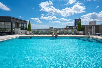Rooftop heated pool with private cabanas
