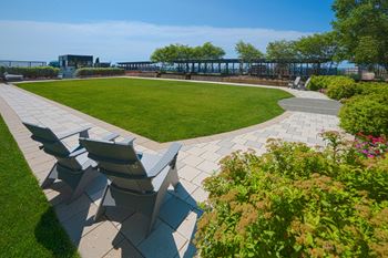Expansive landscaped rooftop gardens and lawn for outdoor games