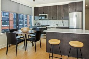 Jersey City apartment for rent - A kitchen with a table and chairs.