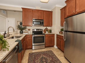 Simsbury apartment for rent - A kitchen with wooden cabinets and stainless steel appliances.
