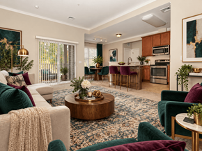 Simsbury apartment for rent - A living room with a white couch, a coffee table, and a green chair.