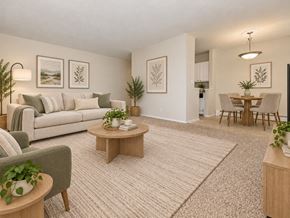 Naugatuck apartment for rent - A living room with a couch, coffee table, and potted plants.