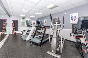 Groton apartment for rent - A gym with treadmills, exercise bikes, and other equipment.