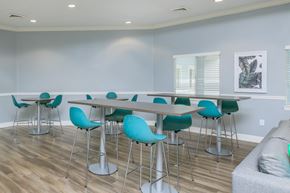 Jacksonville apartment for rent - A dining room with a long table and chairs.
