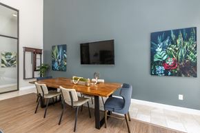 Bradenton apartment for rent - A dining room with a wooden table and chairs.