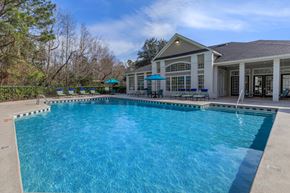 Savannah apartment for rent - A large swimming pool in front of a house.