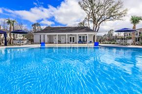 Savannah apartment for rent - A swimming pool with a building in the background.