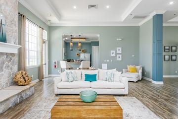 Davenport apartment for rent - A living room with a white couch and a wooden coffee table.