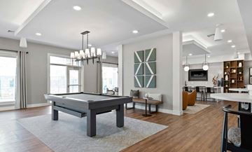 Newington apartment for rent - A modern living room with a pool table and a television.
