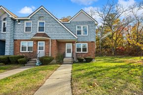 Meriden townhouse for rent - A house with a grey roof and a white door.