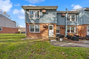 Meriden townhouse for rent - A blue house with a white door and windows.