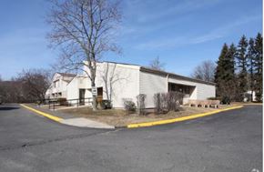 Waterbury apartment for rent - A white building with a yellow line in front of it.