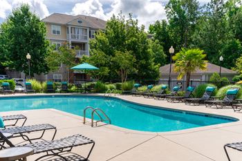 Swimming pool with cushioned seats