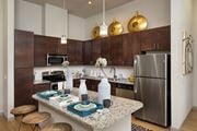 Orlando apartment for rent - a kitchen with stainless steel appliances and a granite counter top at Azul Baldwin Park, Orlando, FL