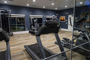Moreno Valley apartment for rent - A gym with treadmills and exercise equipment. at Legends at Rancho Belago, Moreno Valley, CA, 92553