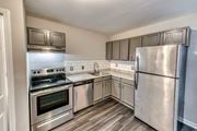 Kannapolis apartment for rent - a kitchen with stainless steel appliances and a stainless steel refrigerator at Ashford Place Apartments, Kannapolis North Carolina