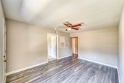 Kannapolis apartment for rent - a living room with wood floors and a ceiling fan at Ashford Place Apartments, Kannapolis, NC 28081